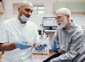 Chevy Chase patient choosing between different denture options