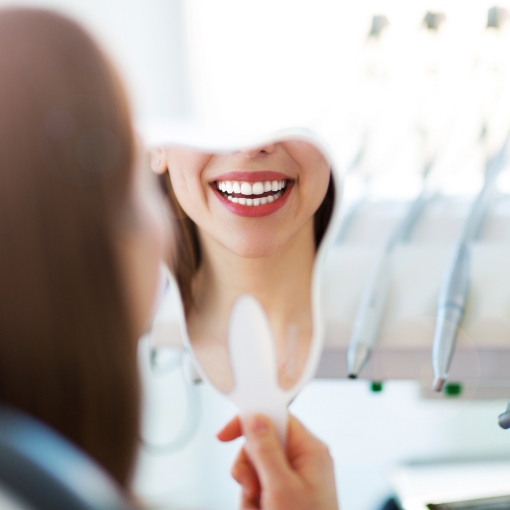 Patient looking at beautiful smile after makeover