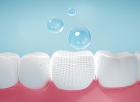 Digital image of bubbles falling towards a tooth
