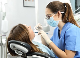 Dentist cleaning a patient’s teeth