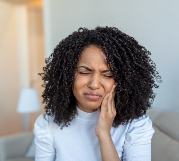 Woman in pain before emergency dentistry