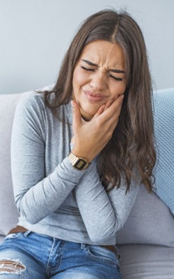 Closeup of woman struggling with tooth pain