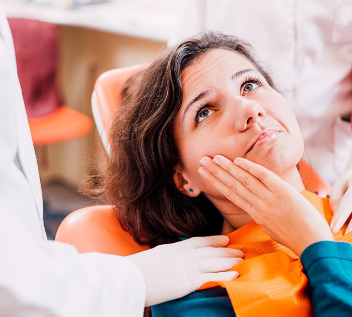 Woman at the dentist with a toothache