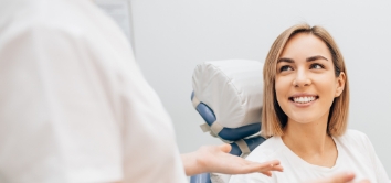 Woman smiling during preventive dentistry visit