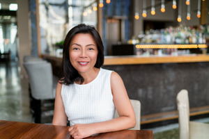 Smiling woman at a cafe