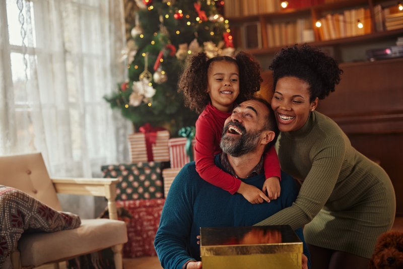 A smiling family celebrating the holidays