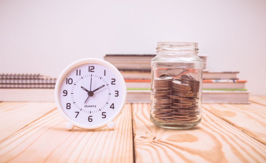 A clock and a jar of money